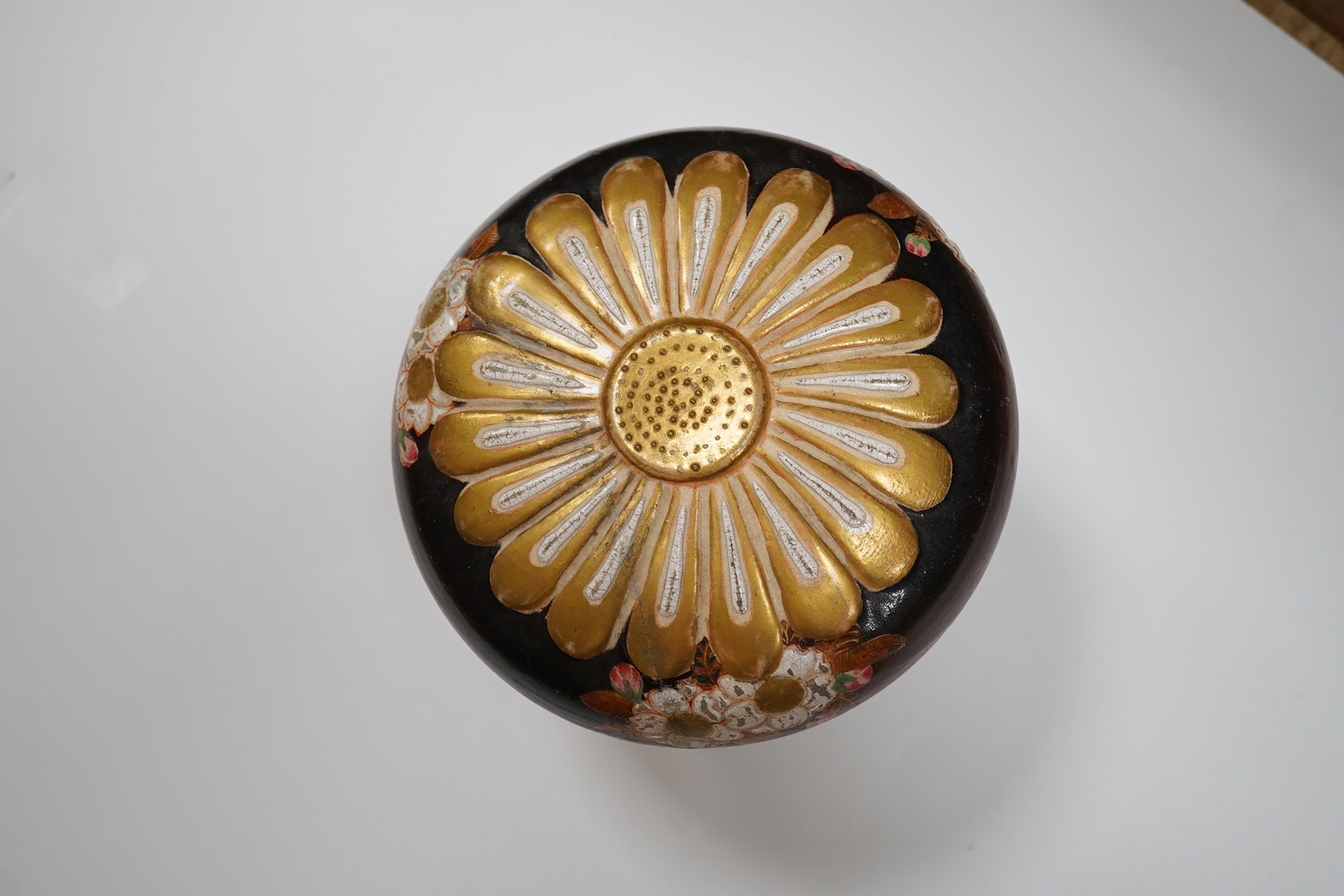 A Japanese Satsuma pottery box and cover on stand, box and cover 14.5cm diameter. Condition - crack to bowl of box and some scratches to surface glazing